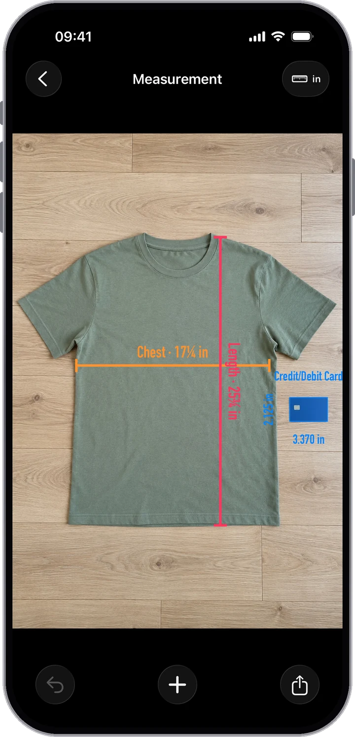 A T-shirt with its chest and length measured and labeled